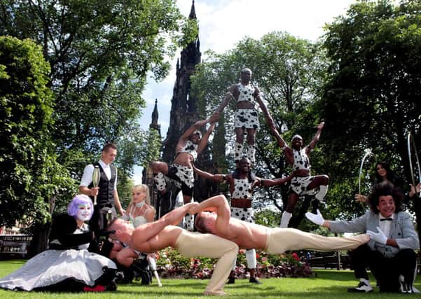 Performers from the Continental Circus Berlin step out in full costume on Princes Street Gardens in Edinburgh. Picture: Hemedia