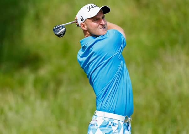 Wallace Booth tees off at the third during an opening round of 68 at Macdonald Spey Valley yesterday. Picture: Getty