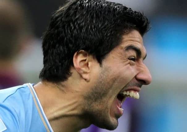 Adidas are to discuss their partnership with Luis Suarez after their World Cup. Picture: PA