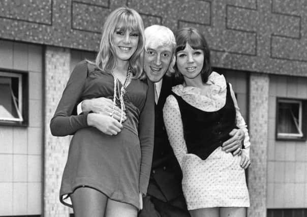 Jimmy Savile in a publicity photo with the hostesses of his TV show in 1968  there is no suggestion they were victims. Picture: Getty