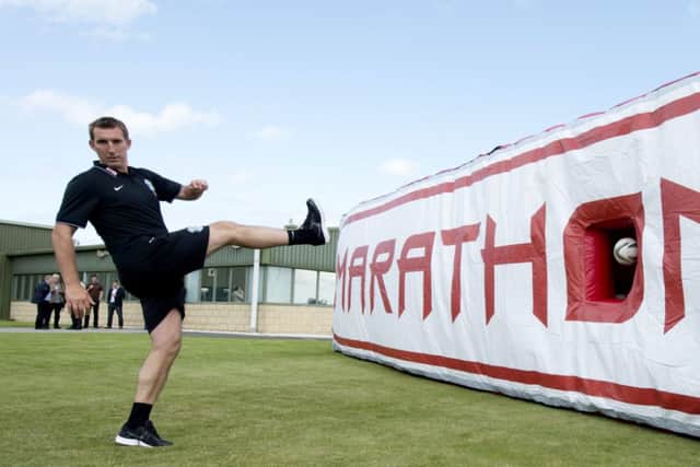 Alan Stubbs shows off his ball skills at Hibernians East Mains training centre yesterday. Picture: SNS