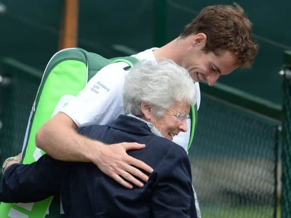 Andy Murray hugs his granmother Shirley Erskine after finishing his practice session at Wimbledon yesterday morning. Picture: Ian Rutherford