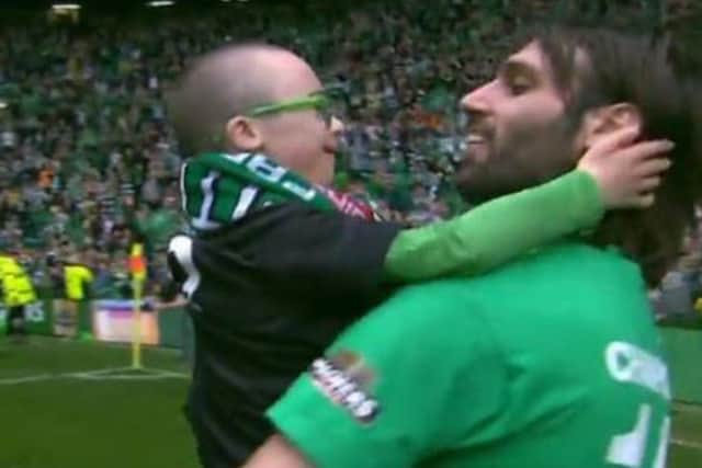 Samaras carried young Jay around the pitch after Celtic lifted the Premiership titile in May