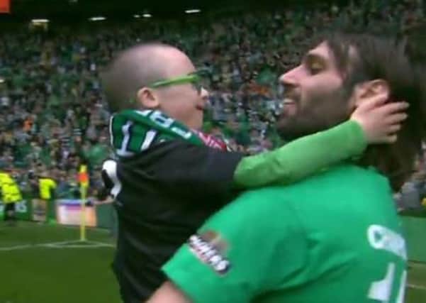 Samaras carried young Jay around the pitch after Celtic lifted the Premiership titile in May