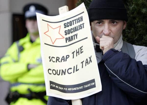Council tax has for a  long time been perceived as a problem in Scotland. Picture: PA