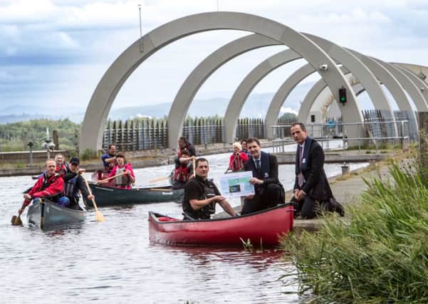 The first canoeists  travel up the Falkirk Wheel for the launch of the Glasgow to Edinburgh Canoe Trail. Picture: Peter Devlin