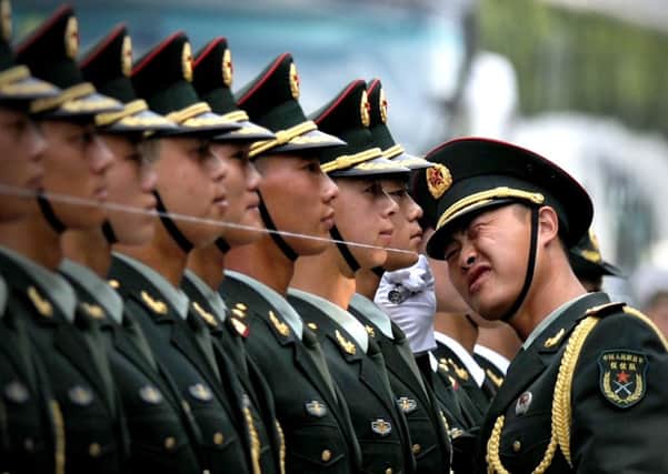 Guards of honour prepare for the arrival of Chinese president Xi Jinping. Picture: Getty