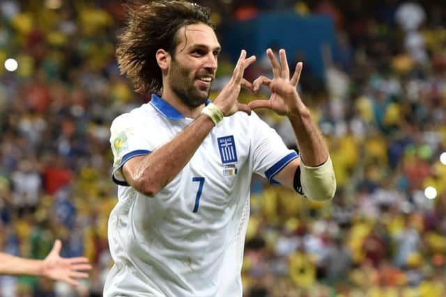 Young Celtic fan Jay Beattie has had to turn down the chance to see Georgios Samaras and his Greek team-mates at the World Cup. Picture: Getty