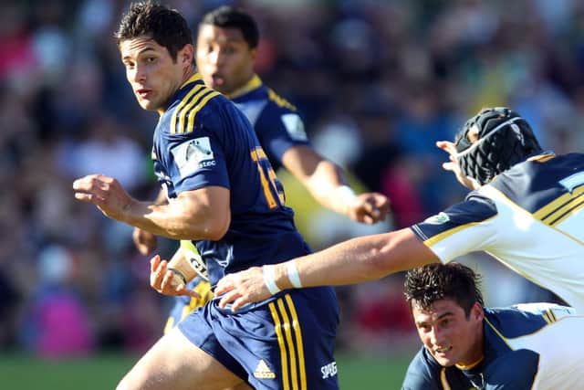 Phil Burleigh tries to burst through the Brumbies defence while playing for Highlanders. Picture: Getty