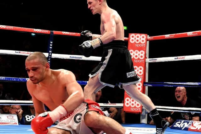 Willie Limond heads for a neutral corner after knocking down Curtis Woodhouse. Picture: SNS