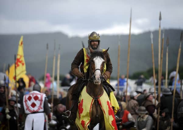 Actors take part in a re-enactment to commemorate the 700th anniversary of the Battle Of Bannockburn. Picture: Getty