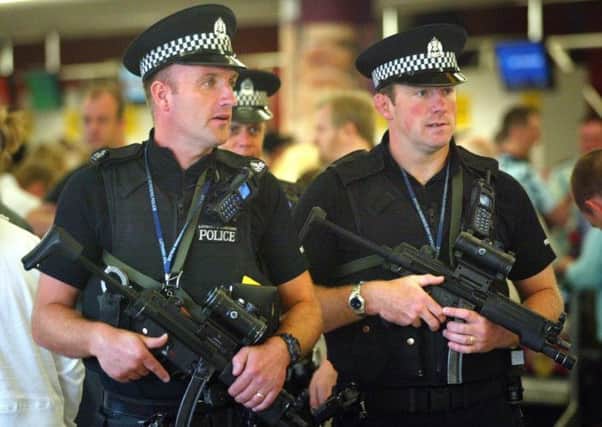 Armed police at Edinburgh Airport but Stephen House wants them on the streets too. Picture: David Cheskin