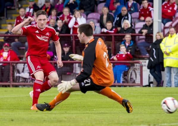 Aberdeen's Declan McManus scores the Dons' 7th goal. Picture: SNS
