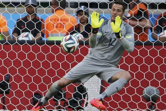 Brazil's Julio Cesar saving a penalty during  the shootout. Picture: Reuters