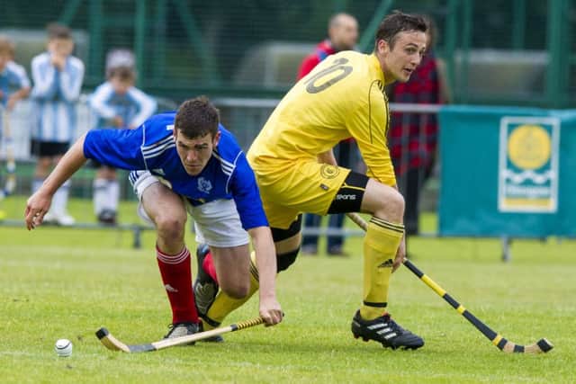 Calum Millar of Kyles, left, tussles with Inverarays Grant Griffin during the Celtic Cup final in Glasgow. Picture: SNS Group