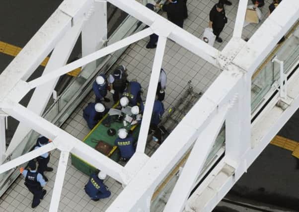 Emergency services in Tokyo at the site of the mans protest. Picture: AP