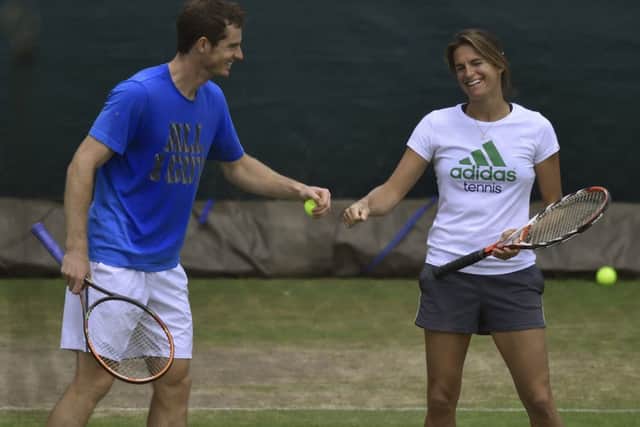 Andy Murray and Amelie Mauresmo look relaxed during practice yesterday ahead of the clash with Kevin Anderson. Picture: Reuters