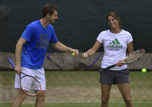 Andy Murray and Amelie Mauresmo look relaxed during practice yesterday ahead of the clash with Kevin Anderson. Picture: Reuters