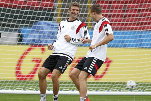 Thomas Muller, left, and Kevin Grosskreutz during a training session in Porto Alegre ahead of their last-16 showdown. Picture: Reuters