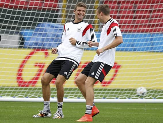 Thomas Muller, left, and Kevin Grosskreutz during a training session in Porto Alegre ahead of their last-16 showdown. Picture: Reuters