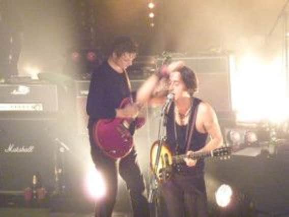The chemistry and charm of the co-frontmen just about sustained them through a frustratingly casual set