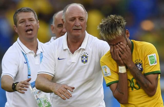 The cracks are beginning to show for Neymar and Scolari after the pressure of the penalty shoot-out. Picture:AFP/Getty