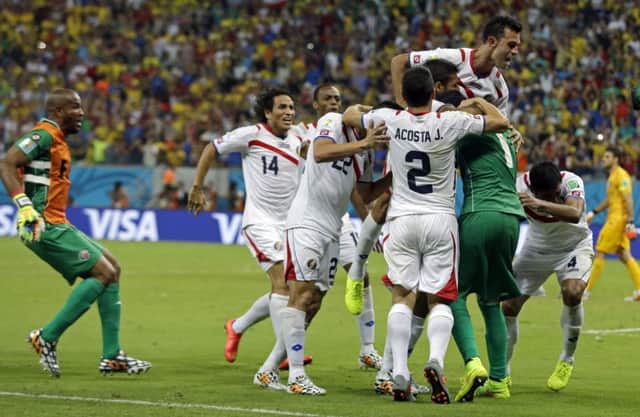 Costa Rica celebrate after winning 5-3 on penalties. Picture: AP