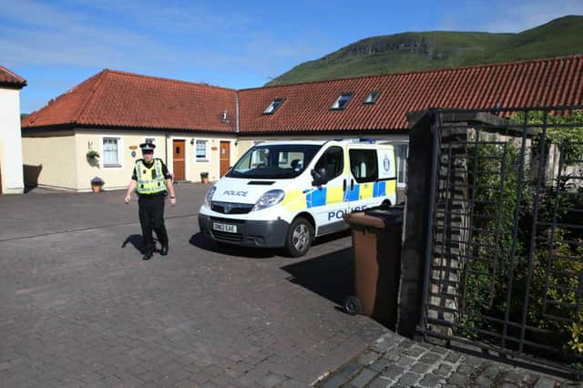 Police at Boll Holiday Cottages in Alva after the body of Colin Machin was discovered in a freezer. Picture: PA