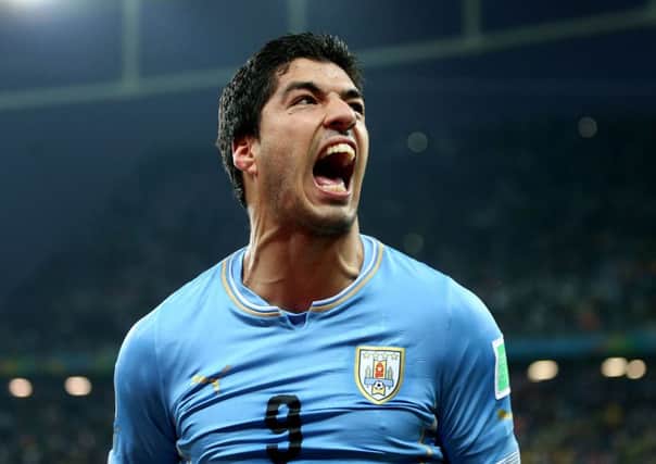 Uruguay striker Luis Suarez was banned for four months from 'football-related activities' for his bite on Giorgio Chiellini. Picture: PA