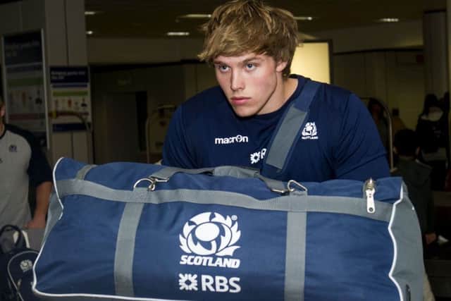 Scotlands Jonny Gray appears in reflective mood as the tour squad arrive back at Edinburgh Airport yesterday. Picture: SNS