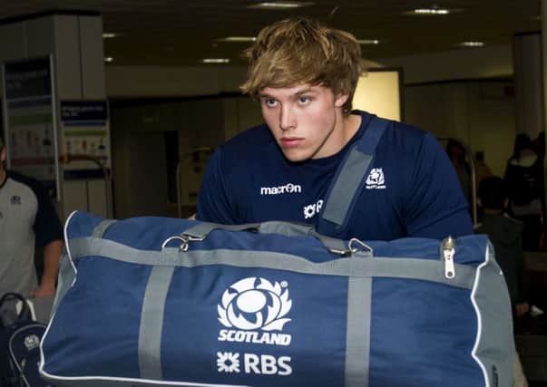 Scotlands Jonny Gray appears in reflective mood as the tour squad arrive back at Edinburgh Airport yesterday. Picture: SNS