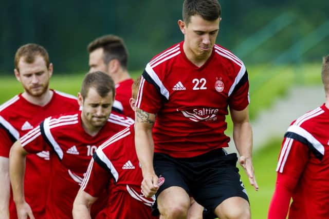 Aberdeens Ryan Jack has a spring in his step during pre-season training yesterday. Picture: SNS