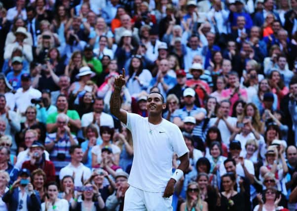 Nick Kyrgios of Australia celebrates match point and winning his match against Rafael Nadal. Picture: Getty
