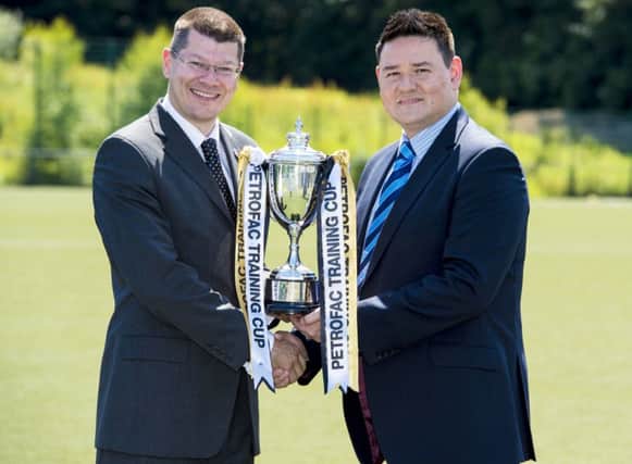 Neil Doncaster (left) joins Petrofac's Laurence Milne to announce the new sponsor. Picture: SNS