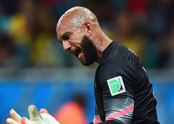 Tim Howard gees himself up during his superb performance against Belgium. Picture: Laurence Griffiths/Getty