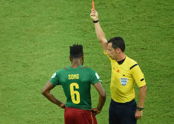 Cameroon and Barcelona midfielder Alexandre Song is given a red card for elbowing a Croatian player. Picture: Getty