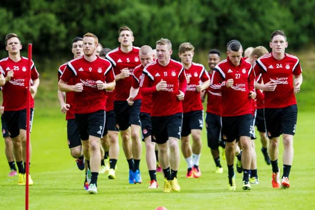 The Aberdeen squad are put through their paces ahead of the Europa League clash. Picture: SNS