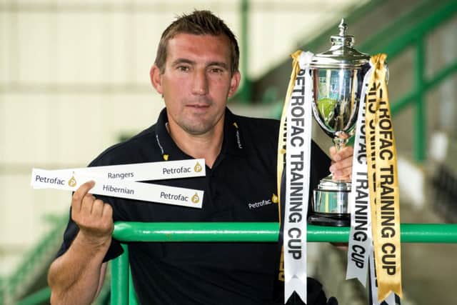 New Hibernian manager Alan Stubbs is on hand as he finds out his side will be facing Rangers in the first round of the Petrofac Training Cup. Picture: SNS