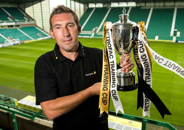 New Hibernian manager Alan Stubbs with the Petrofac Training Cup ahead of the draw. Picture: SNS