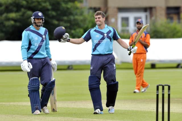 Scotlands Calum MacLeod celebrates his century at Titwood yesterday. The opener went on to make 145. Picture: Donald MacLeod