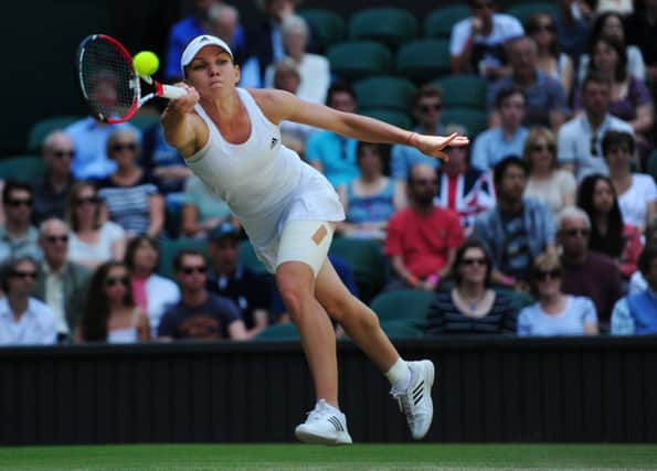 Third seed Simona Halep stretches to return the ball during her win over Sabine Lisicki. Picture: Ian Rutherford