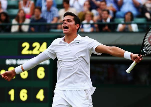 Milos Raonic celebrates after beating Australian Nick Kyrgios in four sets at Wimbledon yesterday. Picture: Getty