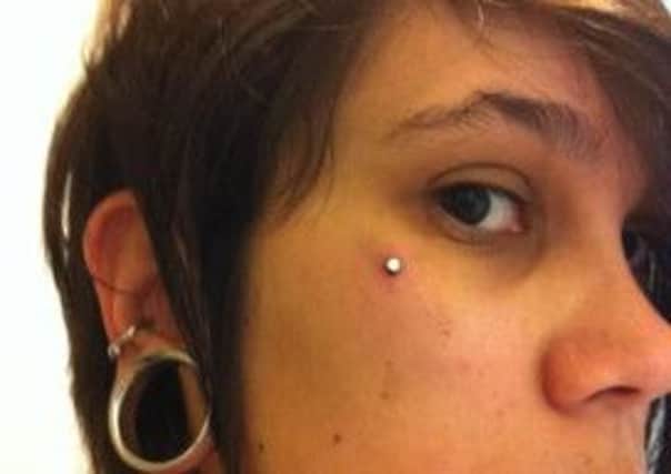 Sub-dermal piercings that involve small plates of metal being placed under the skin as 'anchors' are dangerous warn doctors. Picture: Contributed
