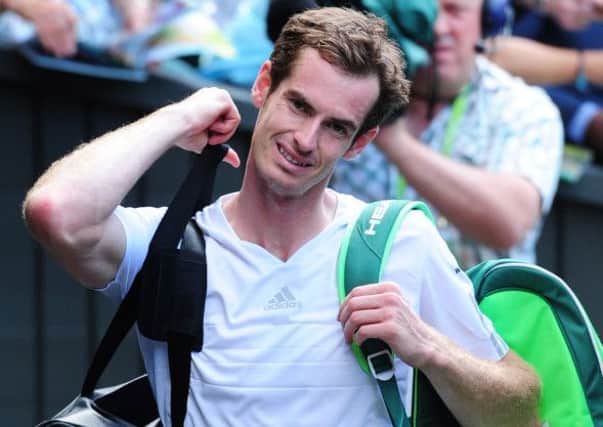 Deposed champion Andy Murray gives a rueful smile as he leaves Centre Court after losing to Grigor Dimitrov. Picture: Ian Rutherford