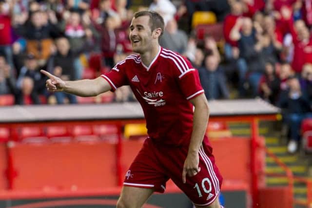 Niall McGinn celebrates after making it 2-0 in last night's win. Picture: SNS
