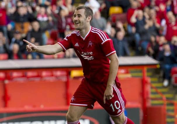 Niall McGinn celebrates after making it 2-0 in last night's win. Picture: SNS