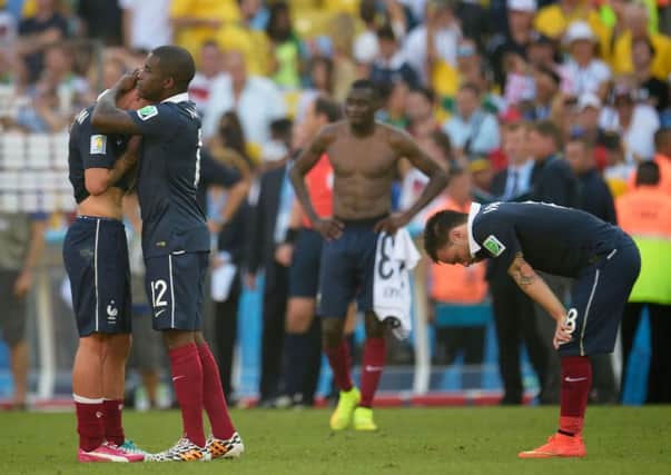 Mathieu Debuchy (L) and Rio Mavuba of France hug after being defeated by Germany 1-0. Picture: Getty