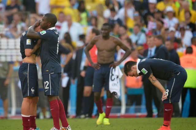 Mathieu Debuchy (L) and Rio Mavuba of France hug after being defeated by Germany 1-0. Picture: Getty