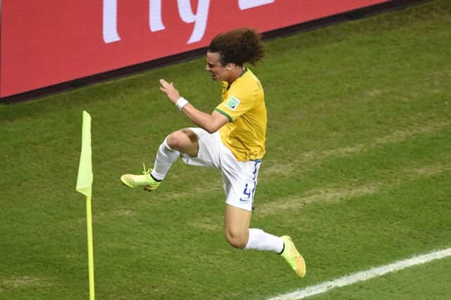 Brazil's defender David Luiz celebrates after scoring a thunderous free kick to help Brazil into a 2-0 lead. Picture: Getty