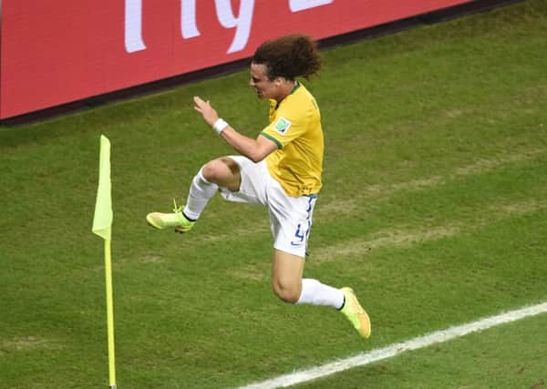 Brazil's defender David Luiz celebrates after scoring a thunderous free kick to help Brazil into a 2-0 lead. Picture: Getty